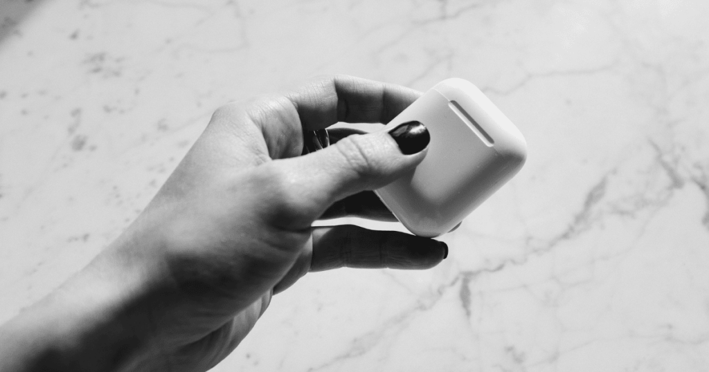 airpod case on hand