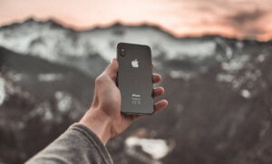 person holding black iphone